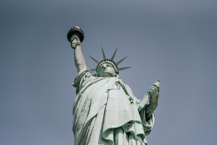 Sunset view of the Statue of Liberty from the ferry near Liberty Island