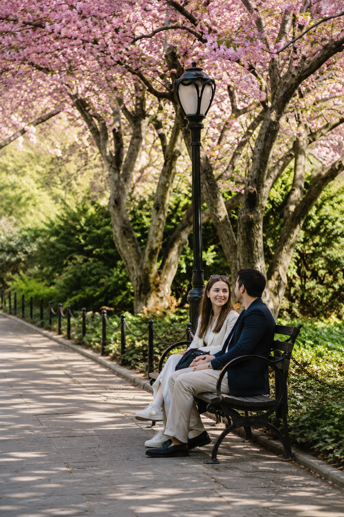 Central Park Conservatory Garden features lush greenery, blooming flowers, landscaped pathways, mature trees, and peaceful garden scenery in New York City during springtime.